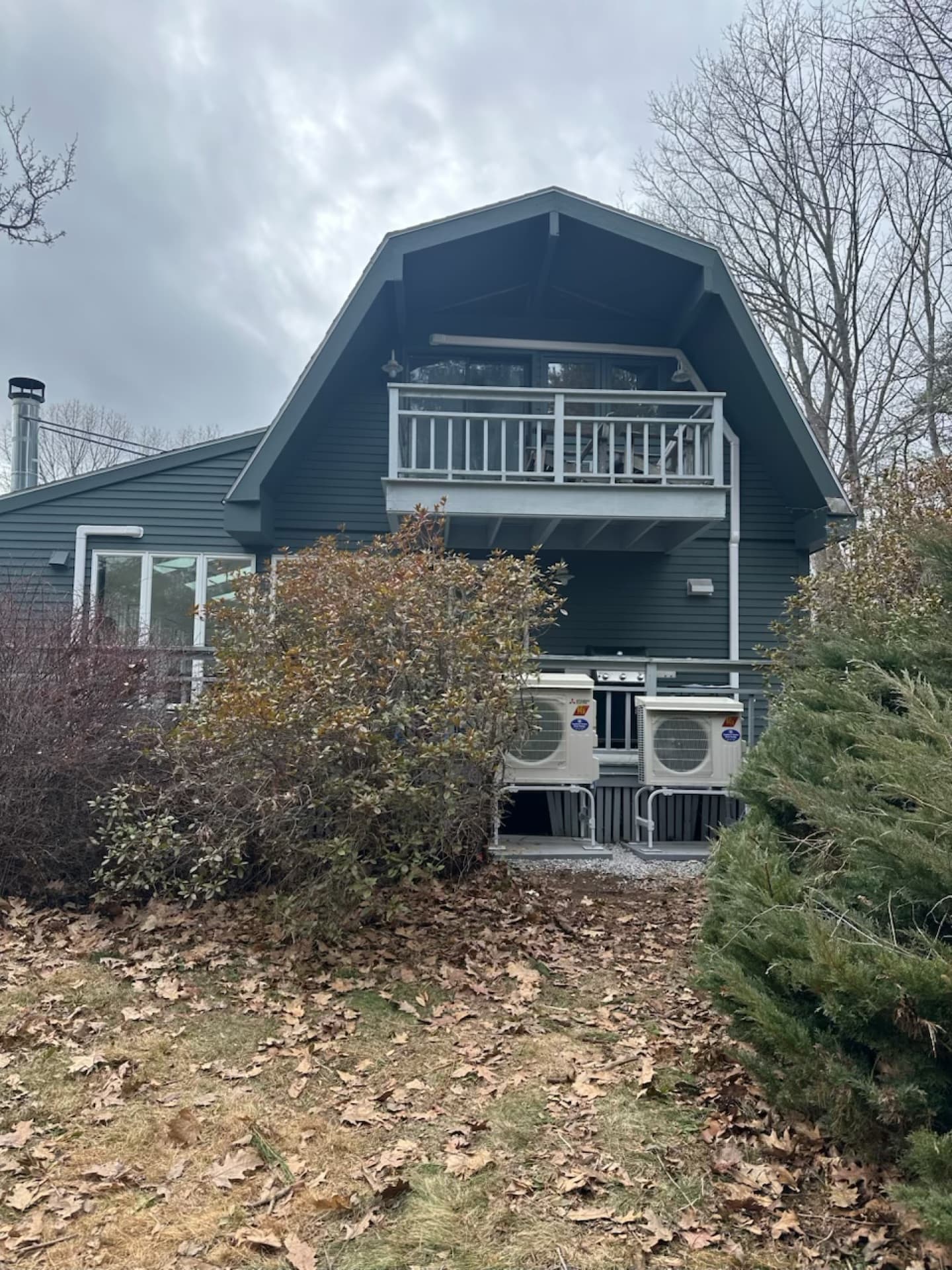 Heat pump outdoor unit operating in snowy Maine winter conditions