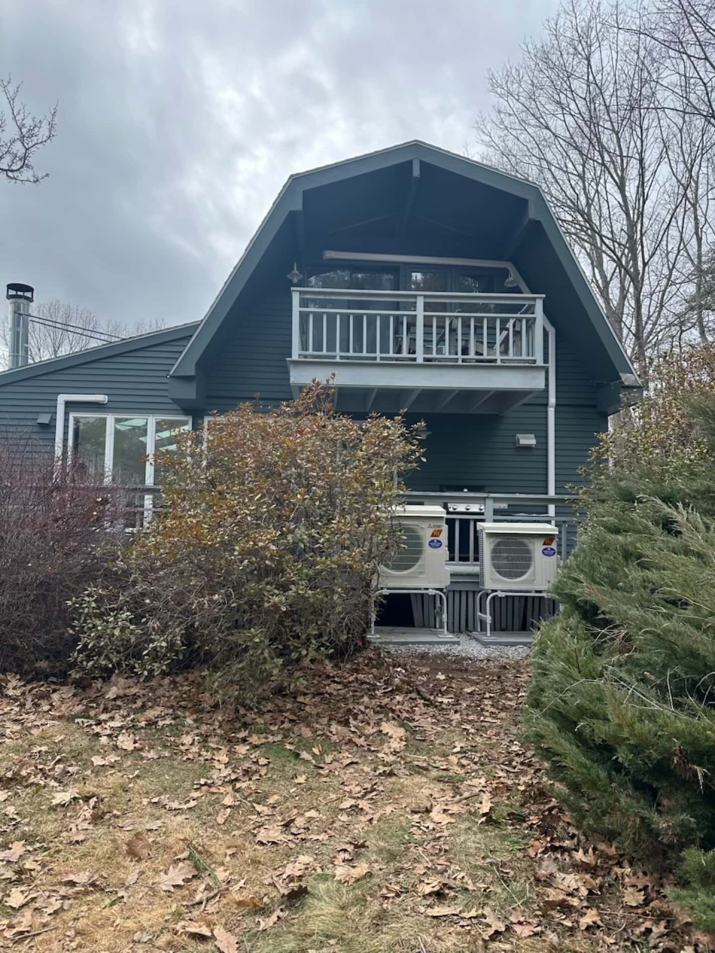 Heat pump outdoor unit operating in snowy Maine winter conditions